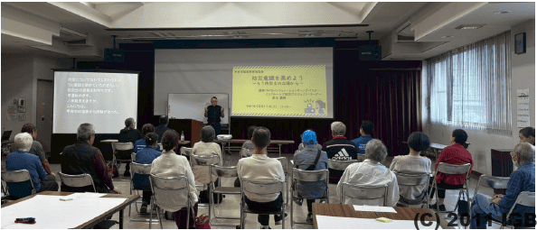 甲府市聴覚障害者協会主催の防災講演会にてNPO法人インフォメーションギャップバスター インクルーシブ防災プロジェクトの鈴木義雅が講演している会場の様子